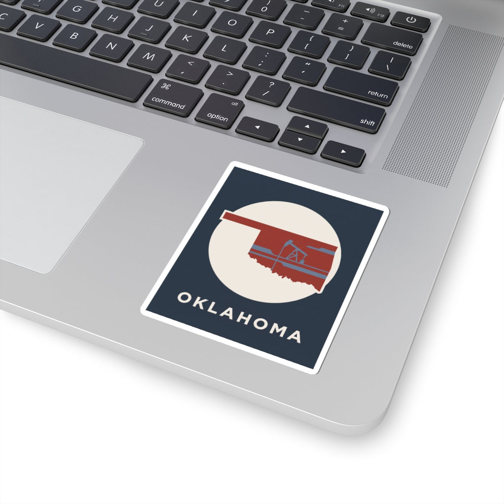 Kiss-cut vinyl Oklahoma sticker with oil rig graphic on laptop lid