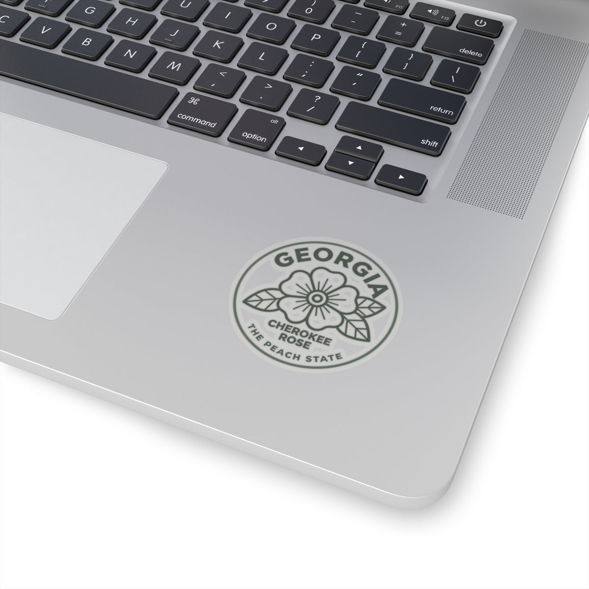 Transparent vinyl decal of Georgia Cherokee rose placed on a laptop lid