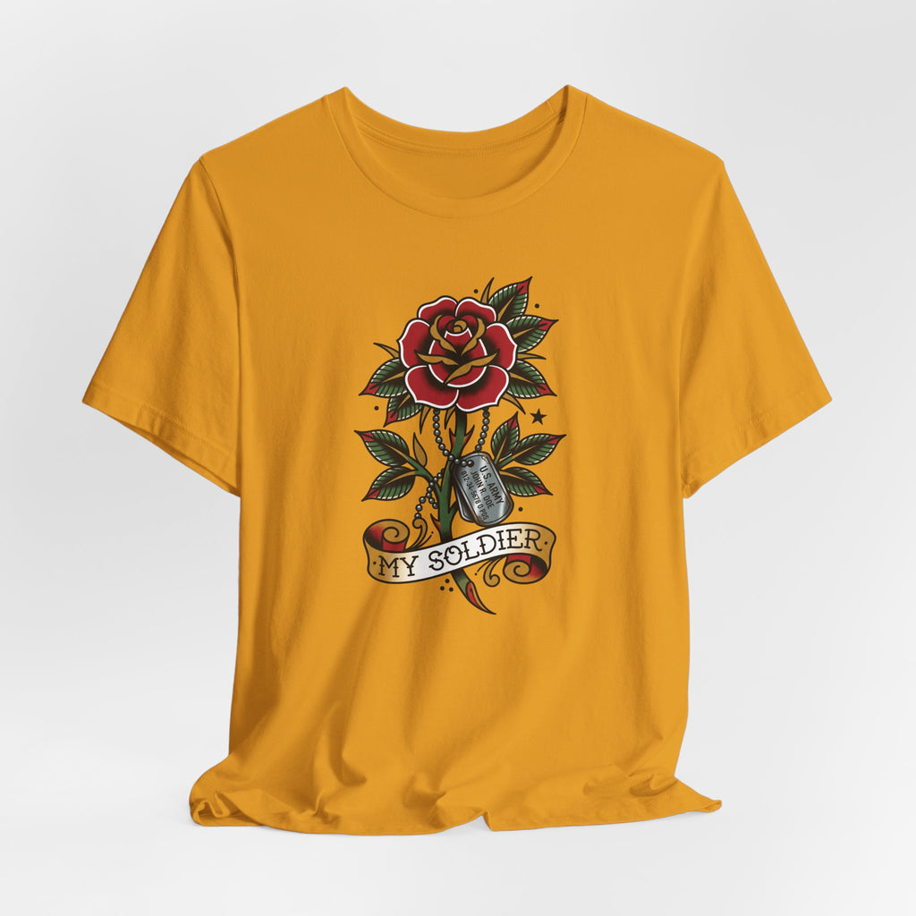 Mustard yellow short-sleeve crewneck T-shirt with rose and dog tag tattoo graphic.