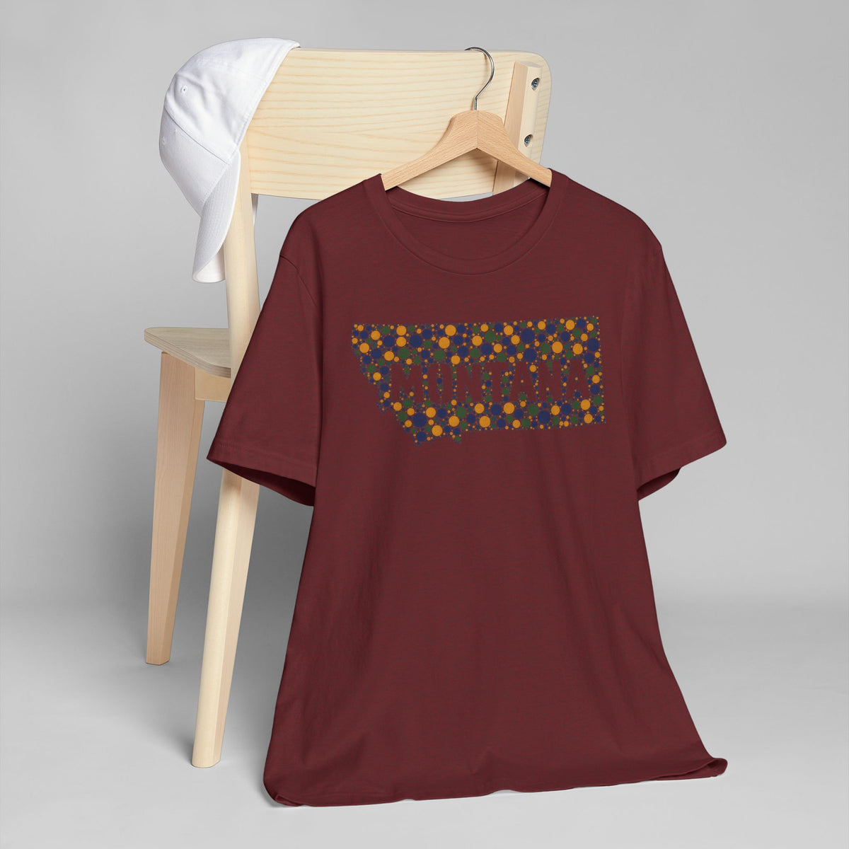 Burgundy crewneck t-shirt with colorful rectangular graphic on chest