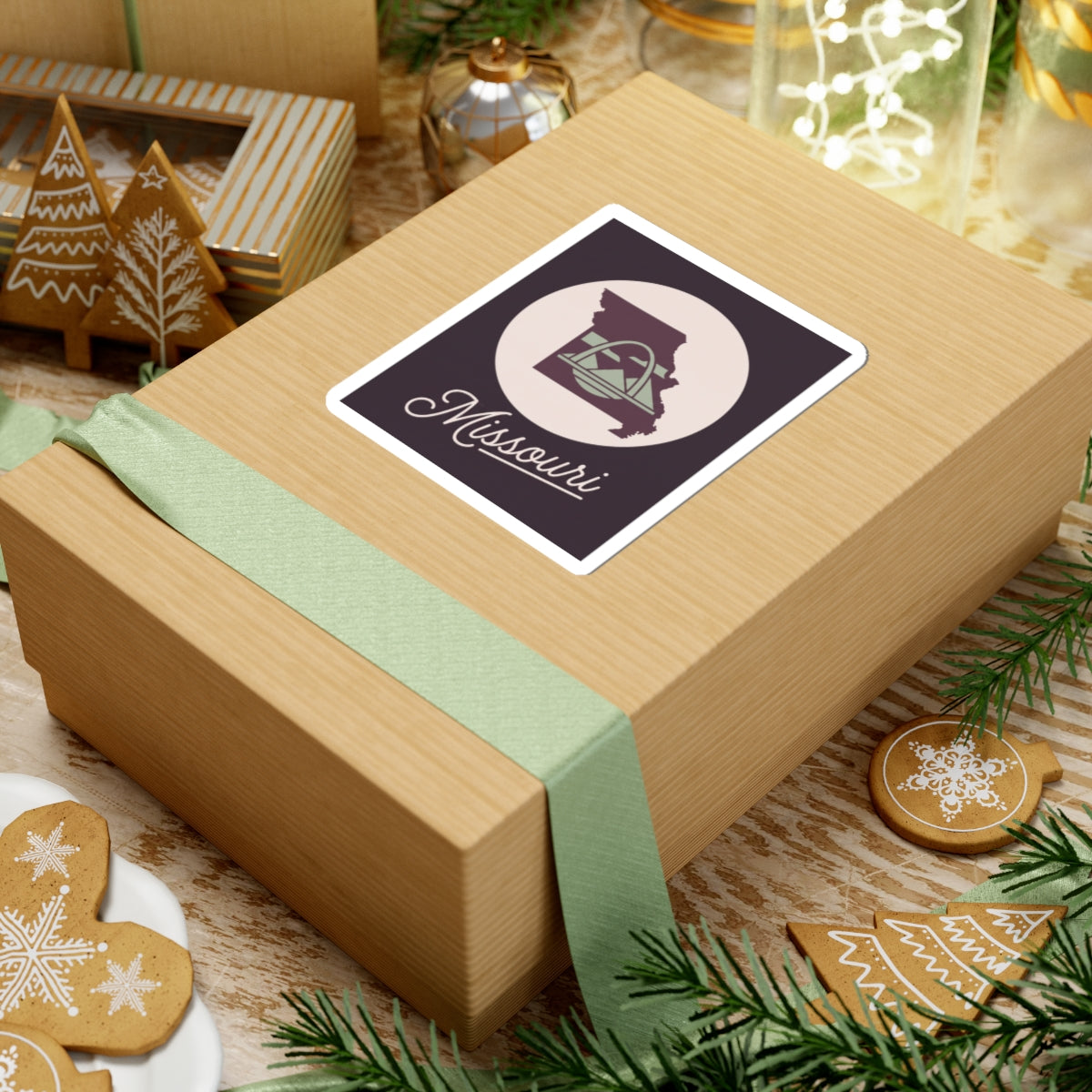 Missouri sticker decal on wrapped gift, dark purple square with circular emblem and script