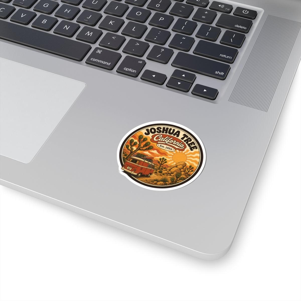Round kiss-cut Joshua Tree National Park sticker with desert and sun, white border