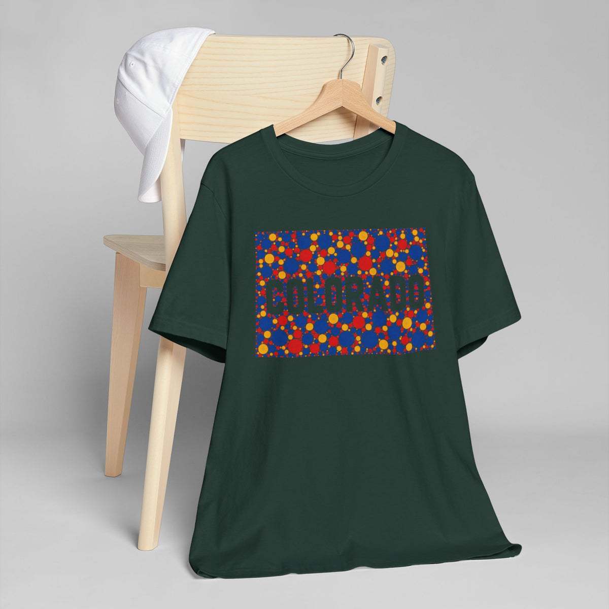 Dark green Colorado graphic t-shirt with multicolor patterned rectangle and outline print