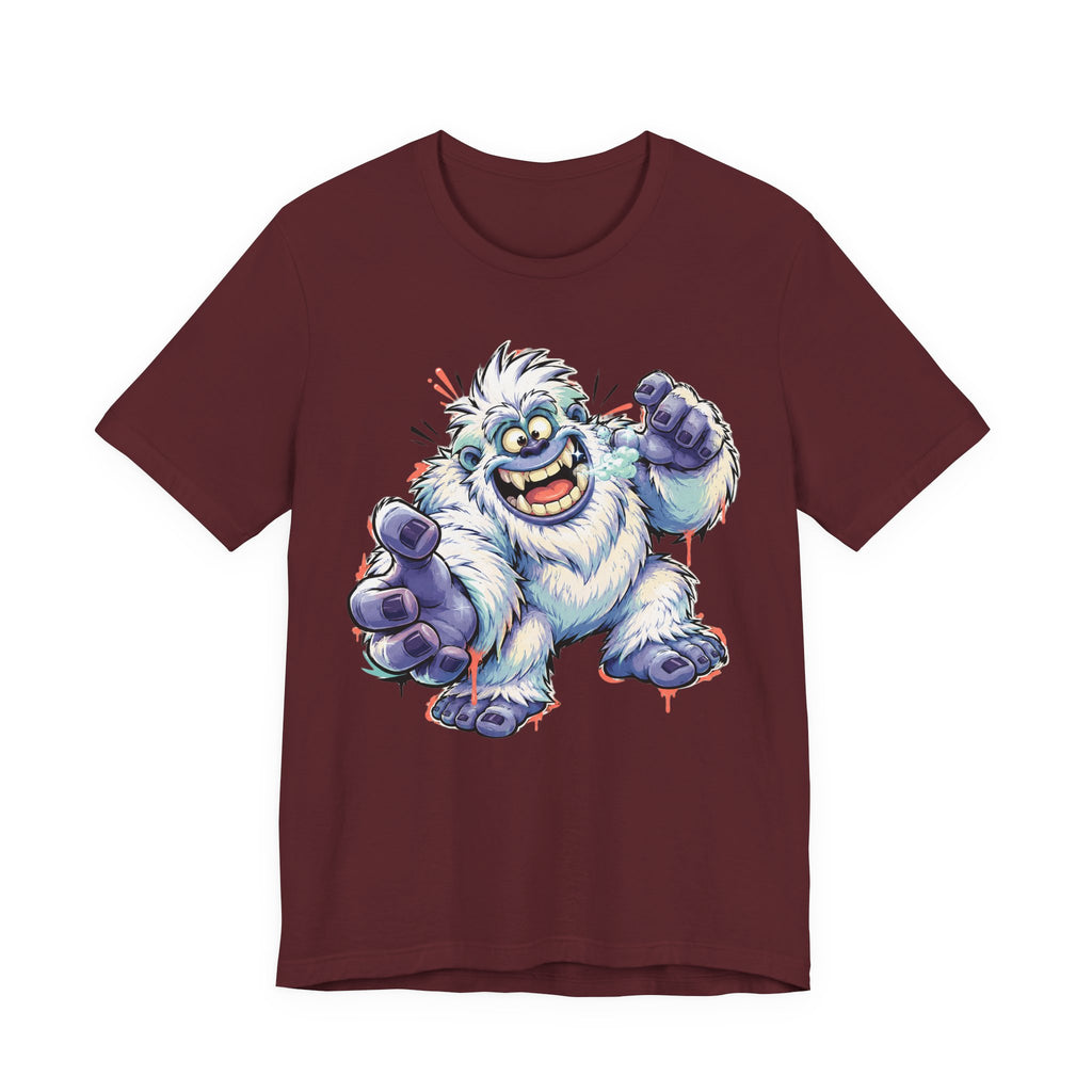 Maroon monster t-shirt with cartoon yeti creature graphic waving and grinning
