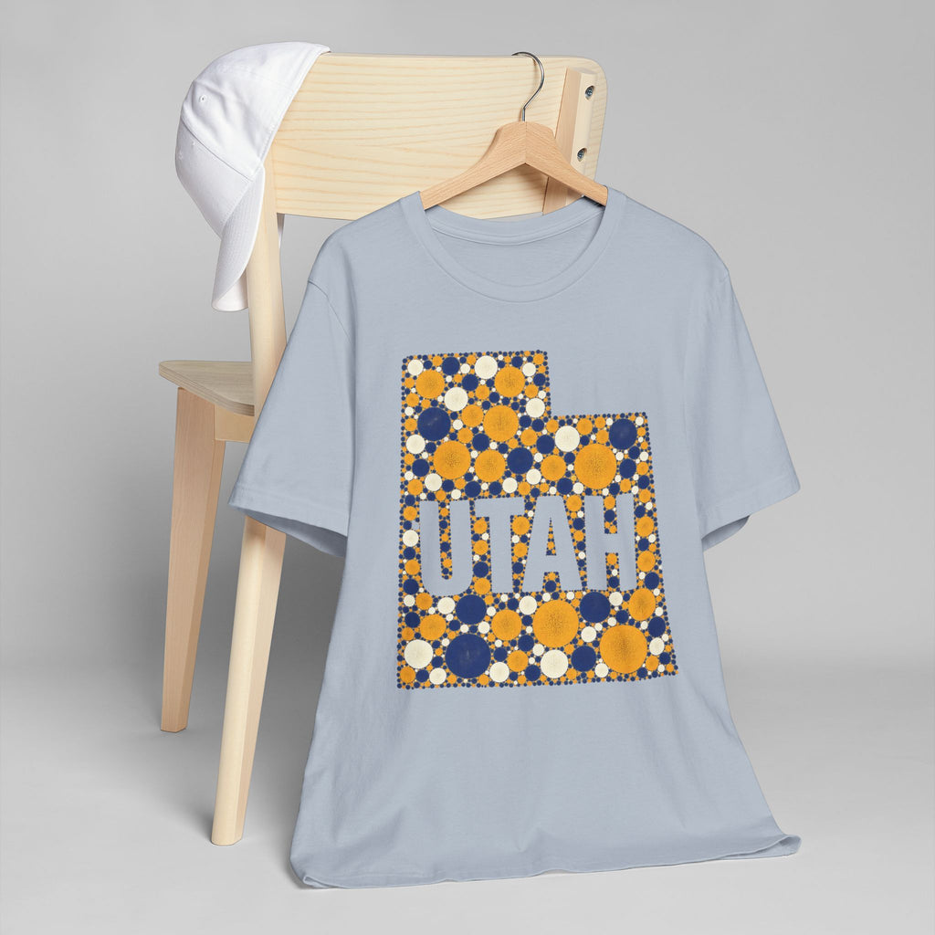 Light blue crew-neck T-shirt with multicolor polka dot UTAH graphic