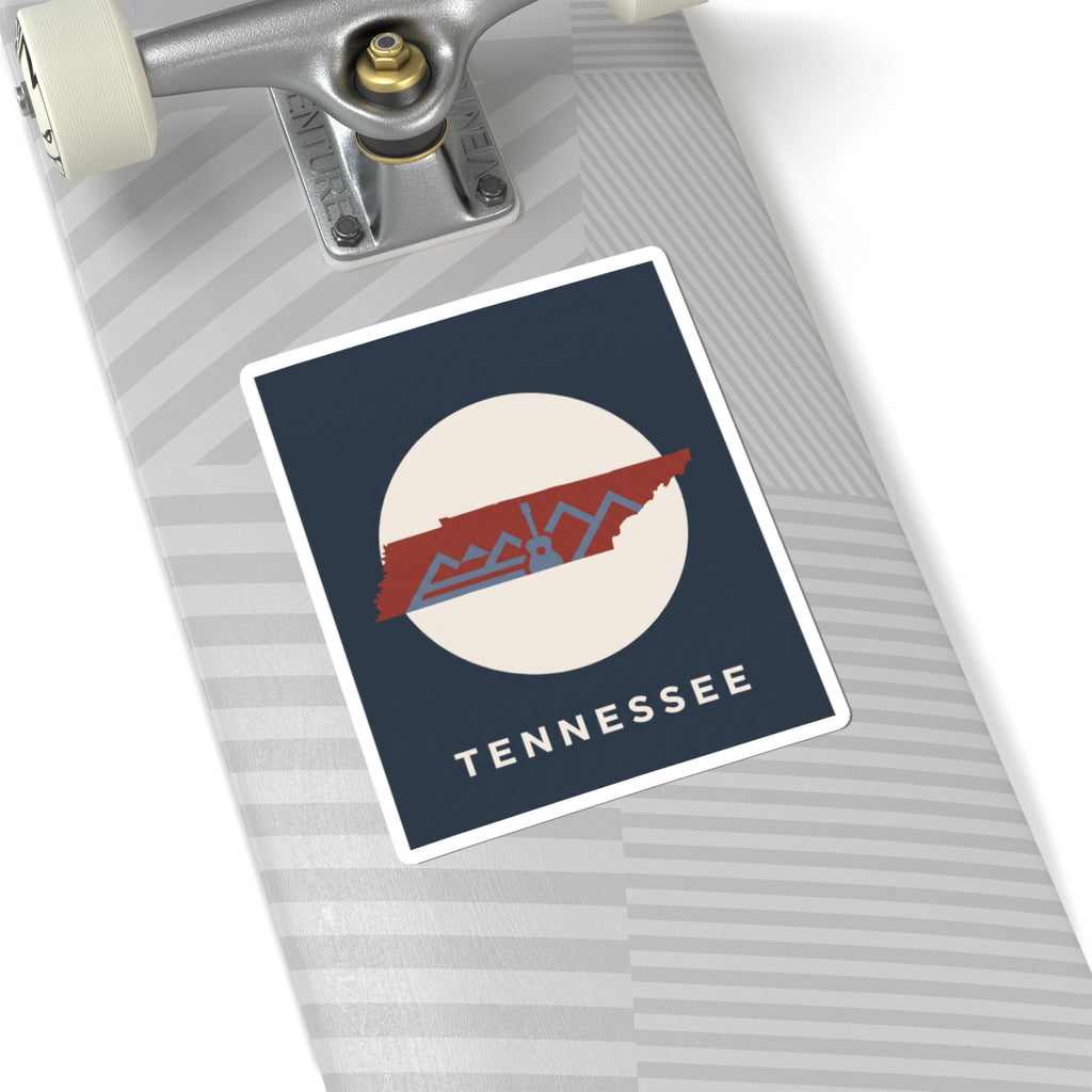 Tennessee outline sticker with retro mountains and guitar detail on a skateboard deck