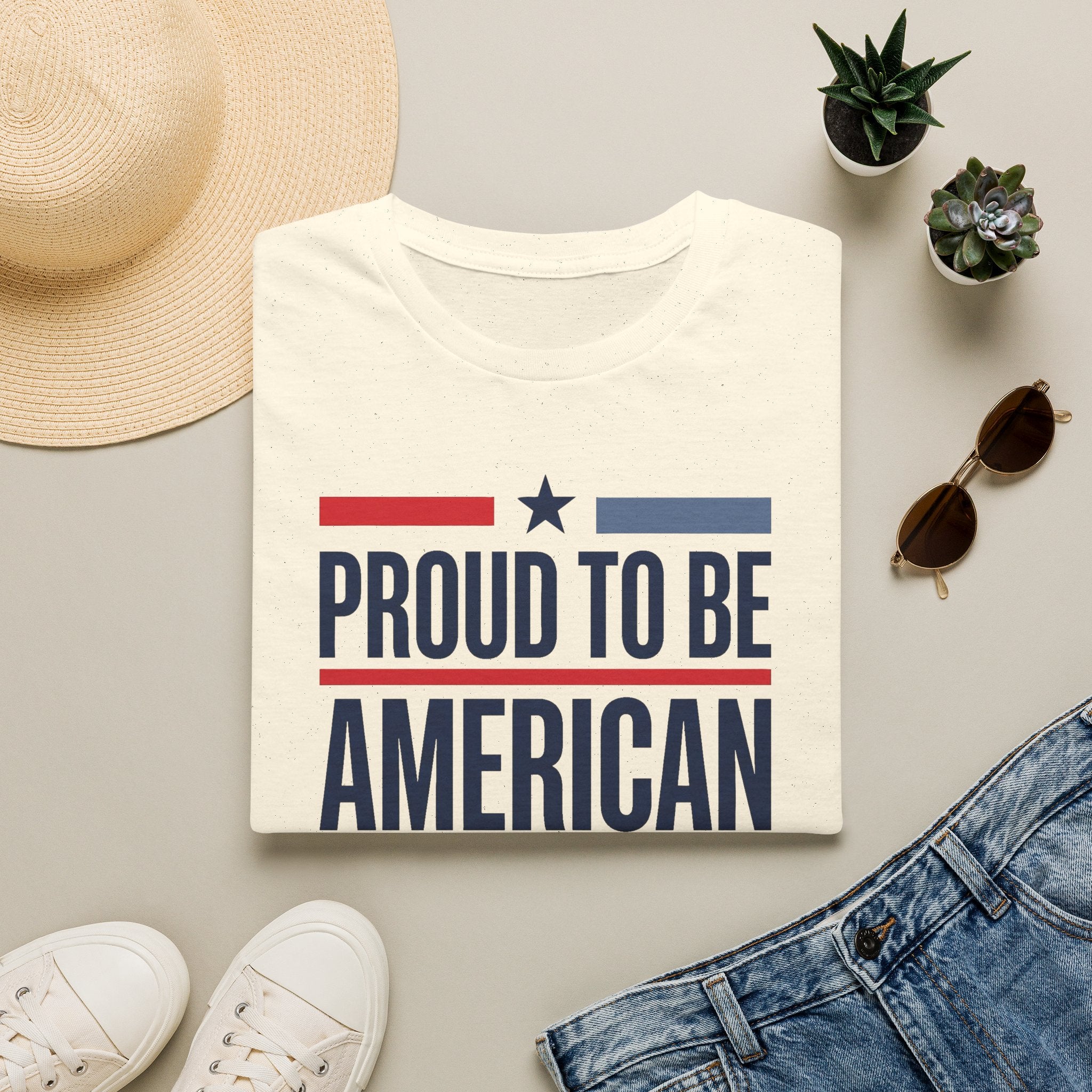 White crewneck T-shirt with star-and-stripe "PROUD TO BE AMERICAN" graphic