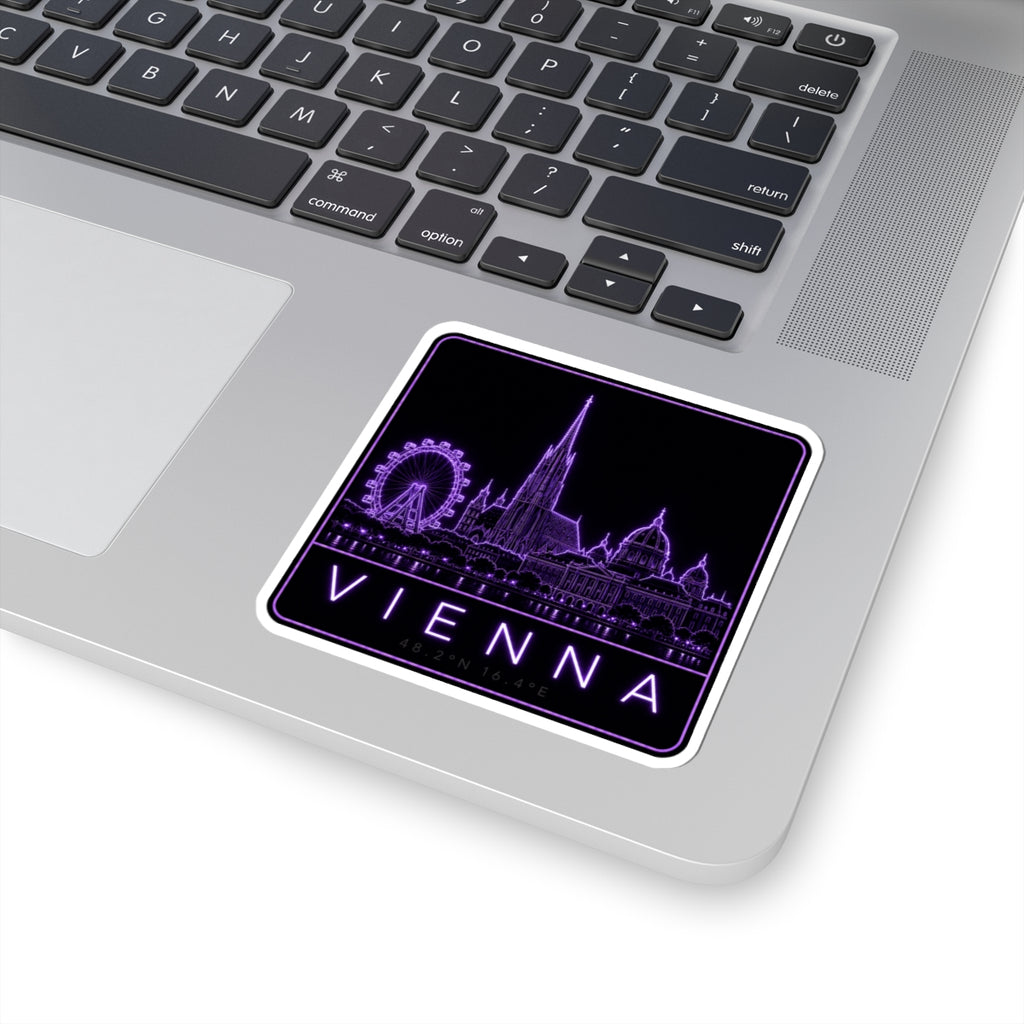 Neon Vienna skyline sticker on a laptop keyboard, purple buildings and VIENNA text