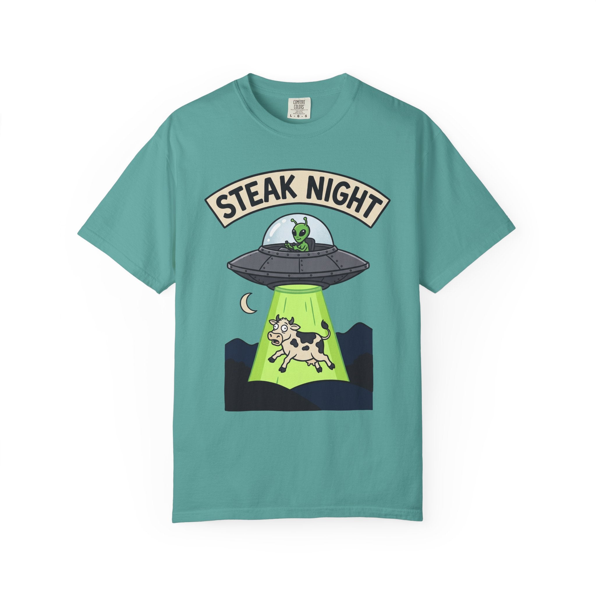 Teal T-shirt with “Steak Night” alien and cow graphic