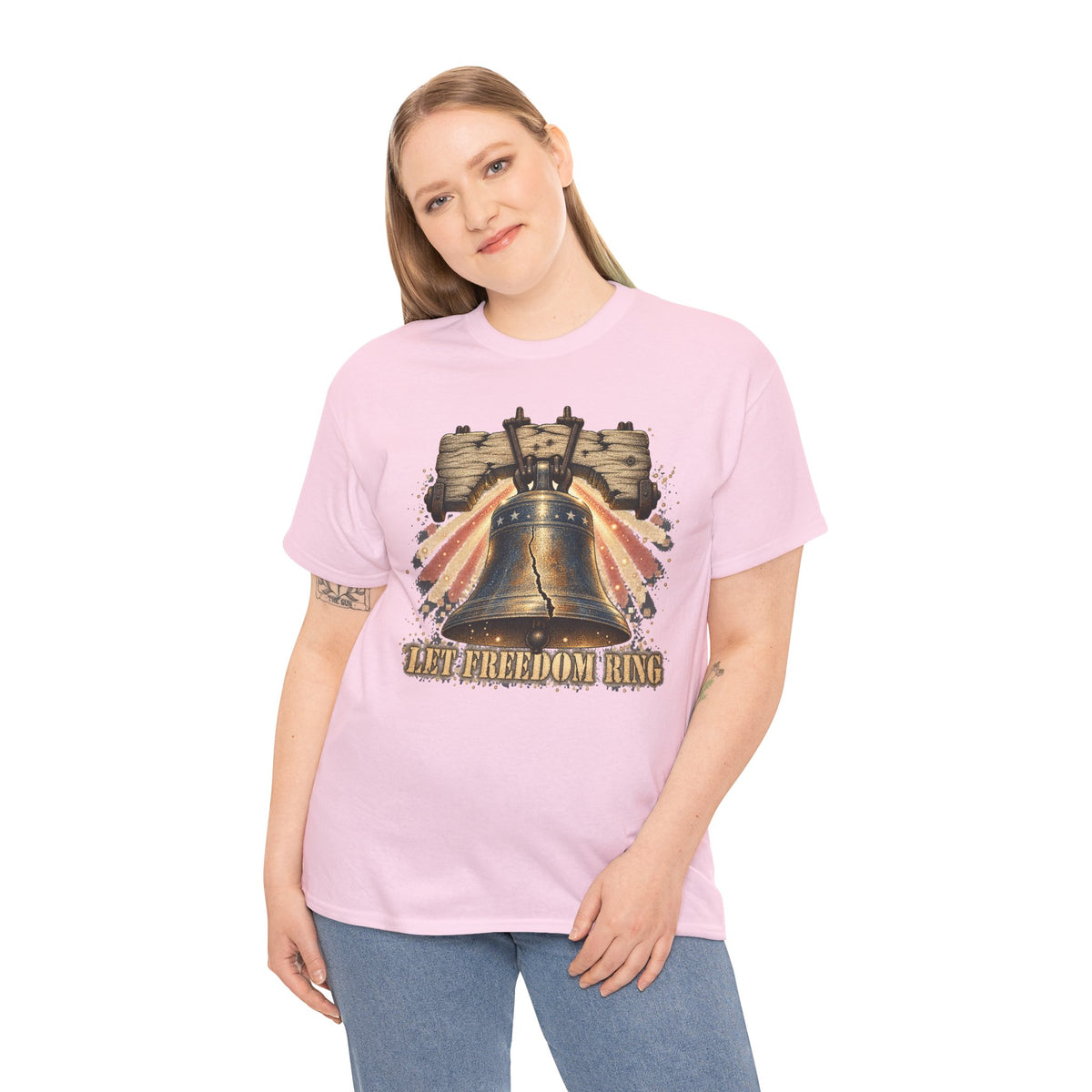 Pink short-sleeve t-shirt worn by model; liberty bell front graphic