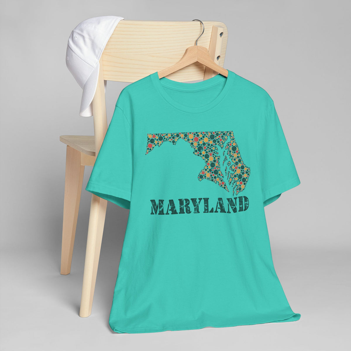 Teal T-shirt with Maryland floral map graphic and MARYLAND text