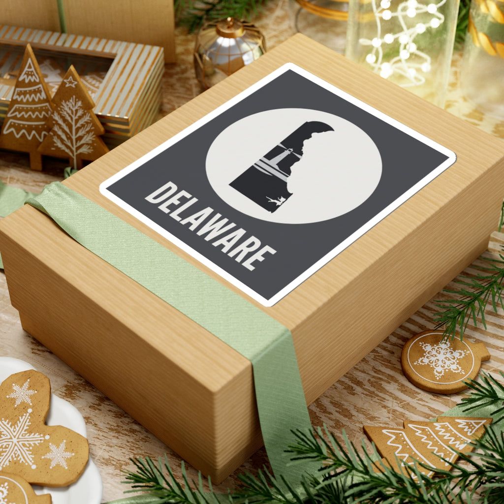 Delaware state silhouette sticker on gift box, white circle badge and DELAWARE wordmark