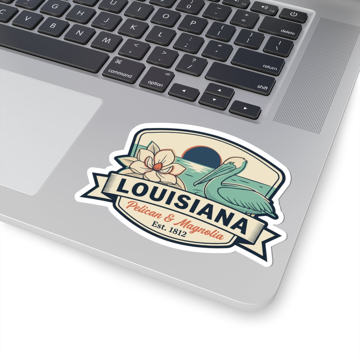 Louisiana pelican & magnolia sticker decal with vintage oval badge and ribbon banner wording.
