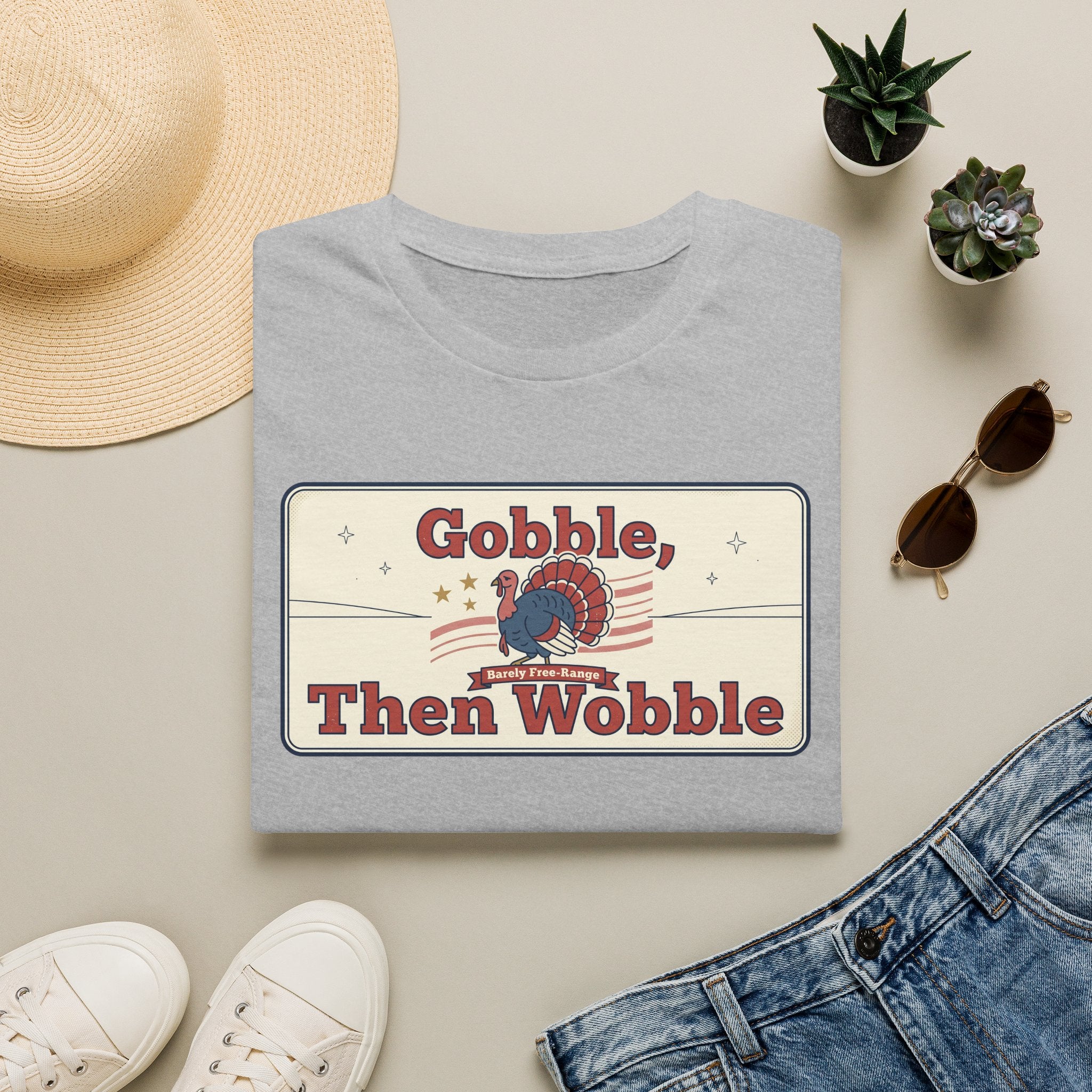 Light gray T-shirt with retro turkey graphic and bold “Gobble, Then Wobble” text