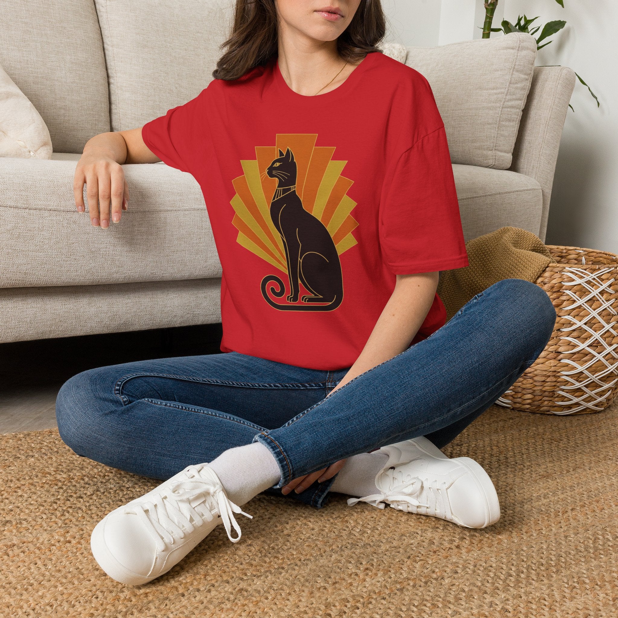 Red cat graphic T-shirt with orange sunburst design at center chest