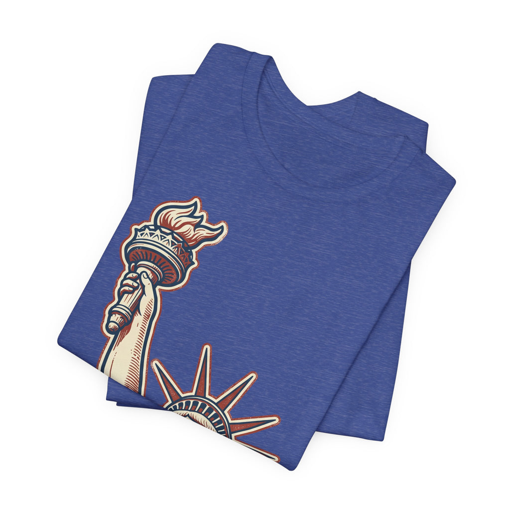 Blue crewneck graphic tee with Statue of Liberty style illustration on front.