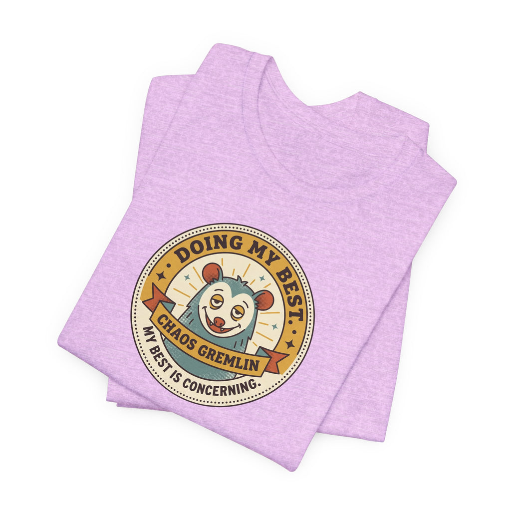 Lavender T-shirt with circular gremlin badge graphic, short sleeves, crew neck.
