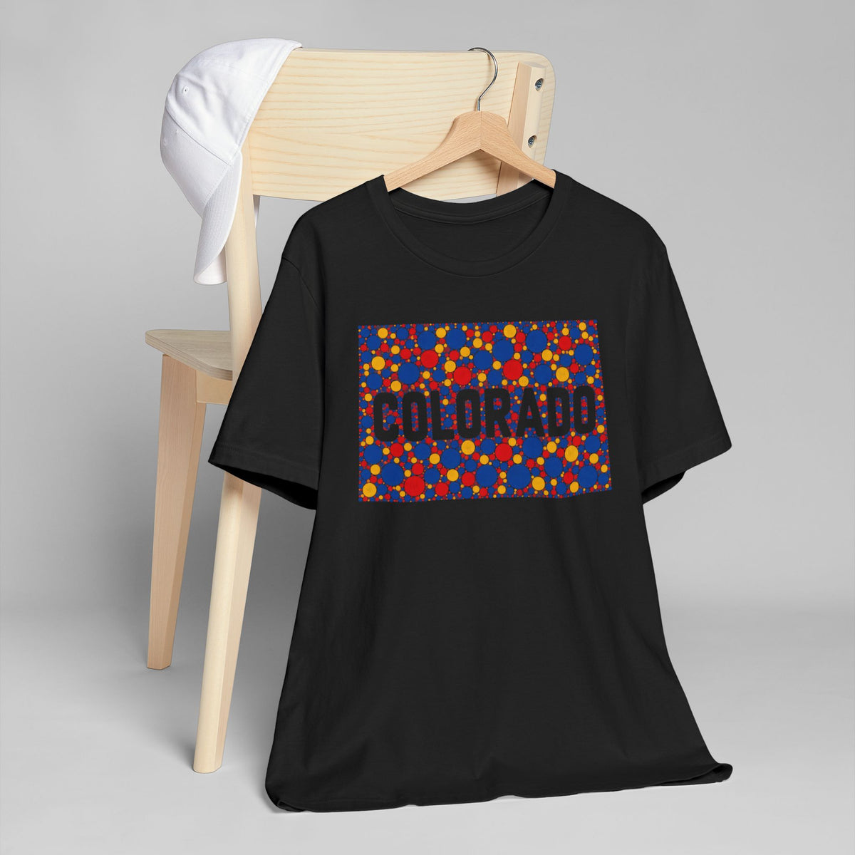 Black crew-neck short-sleeve t-shirt with colorful “COLORADO” rectangle graphic