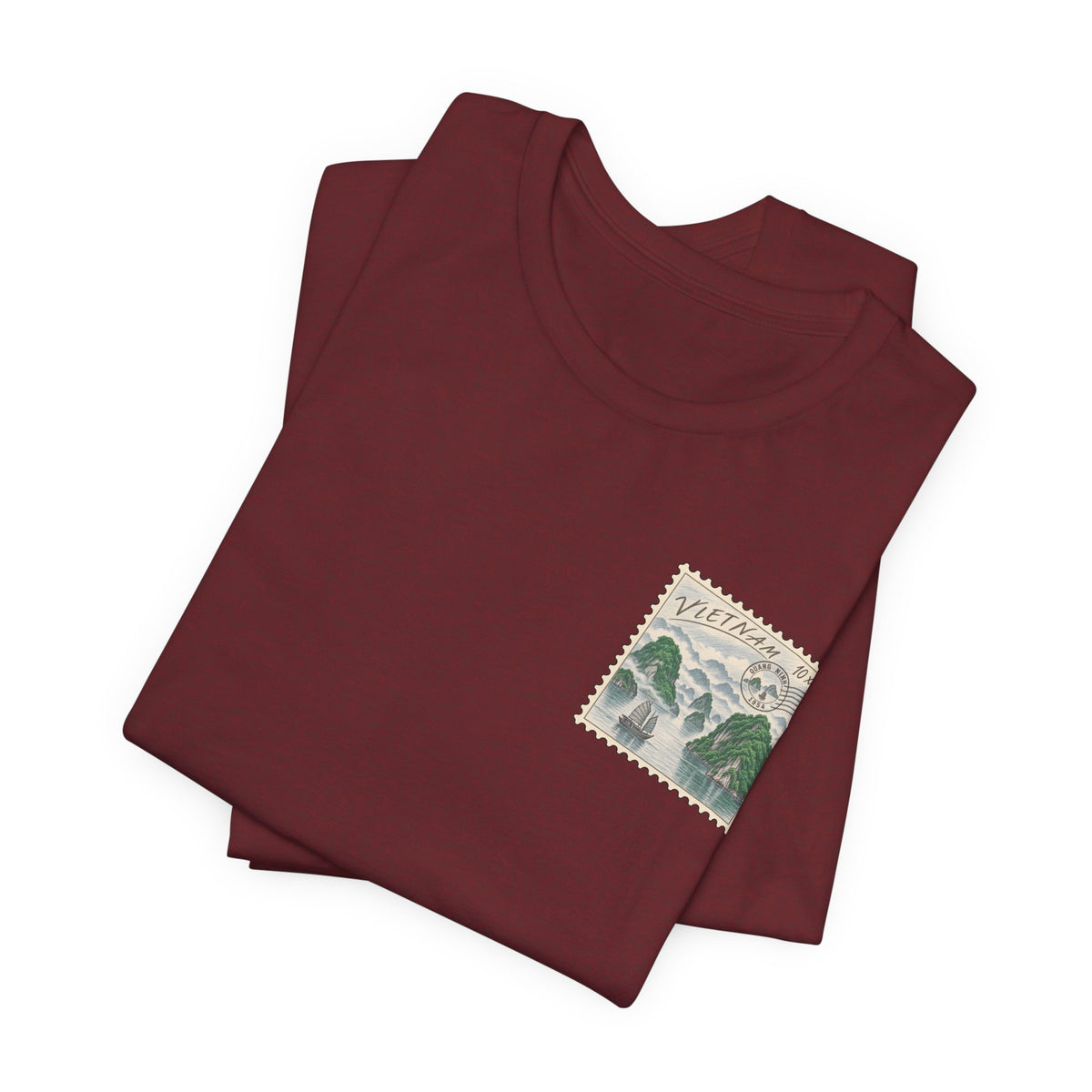 Vintage travel t-shirt, dark red, folded with small postage-stamp style graphic
