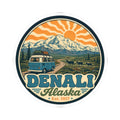 Round sticker with Denali Alaska lettering, mountain scenery, sun rays, and teal van