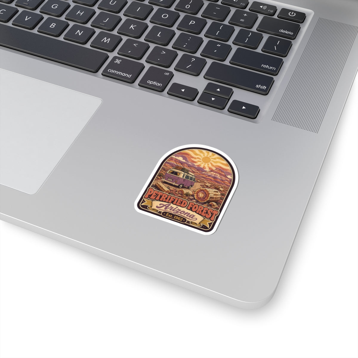 Petrified Forest vintage kiss-cut sticker, desert landscape and orange sun in a border.