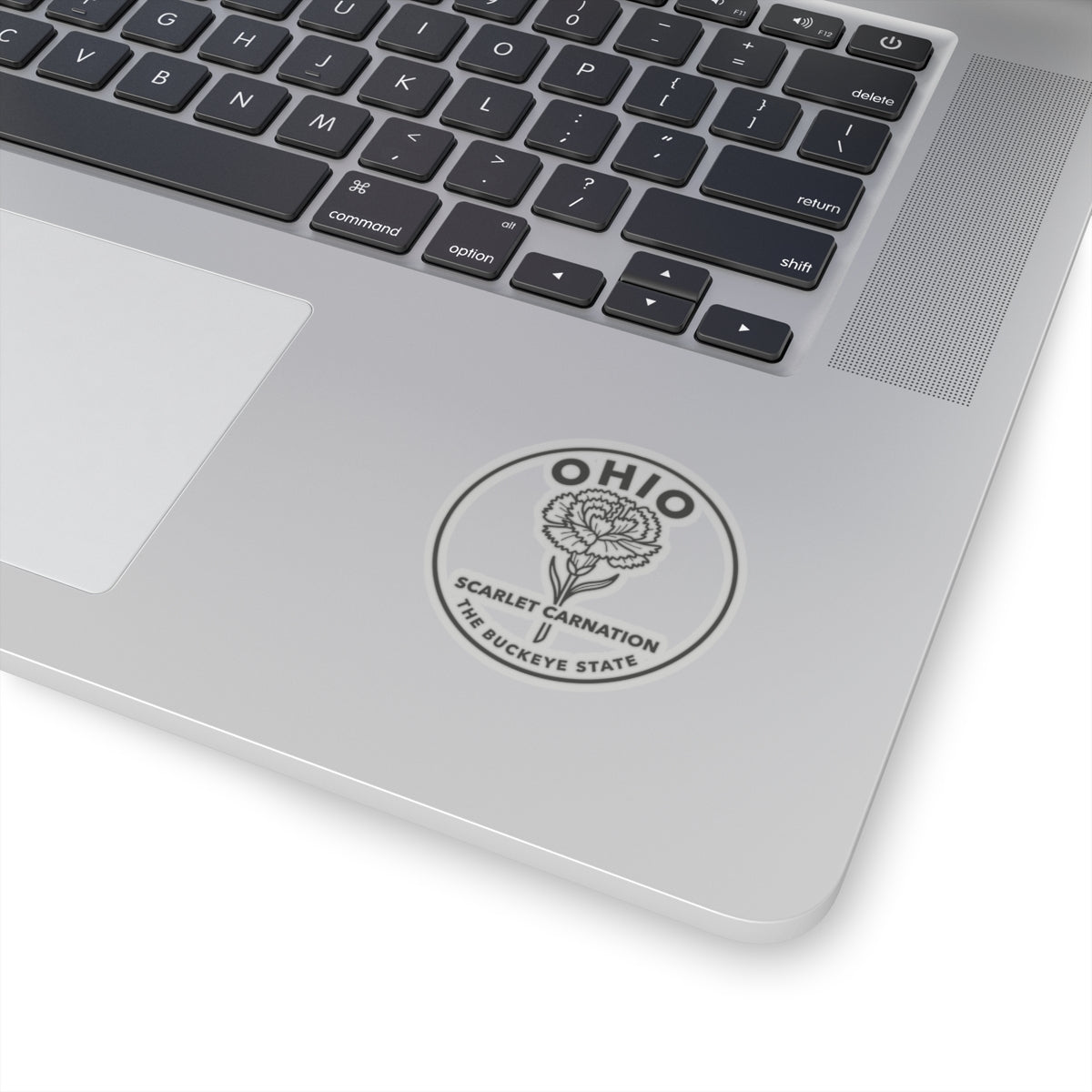 Round Ohio scarlet carnation sticker on laptop lid, transparent vinyl