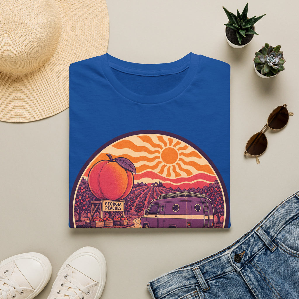 Royal blue unisex crewneck T-shirt with retro peach sunset camper van graphic on front.