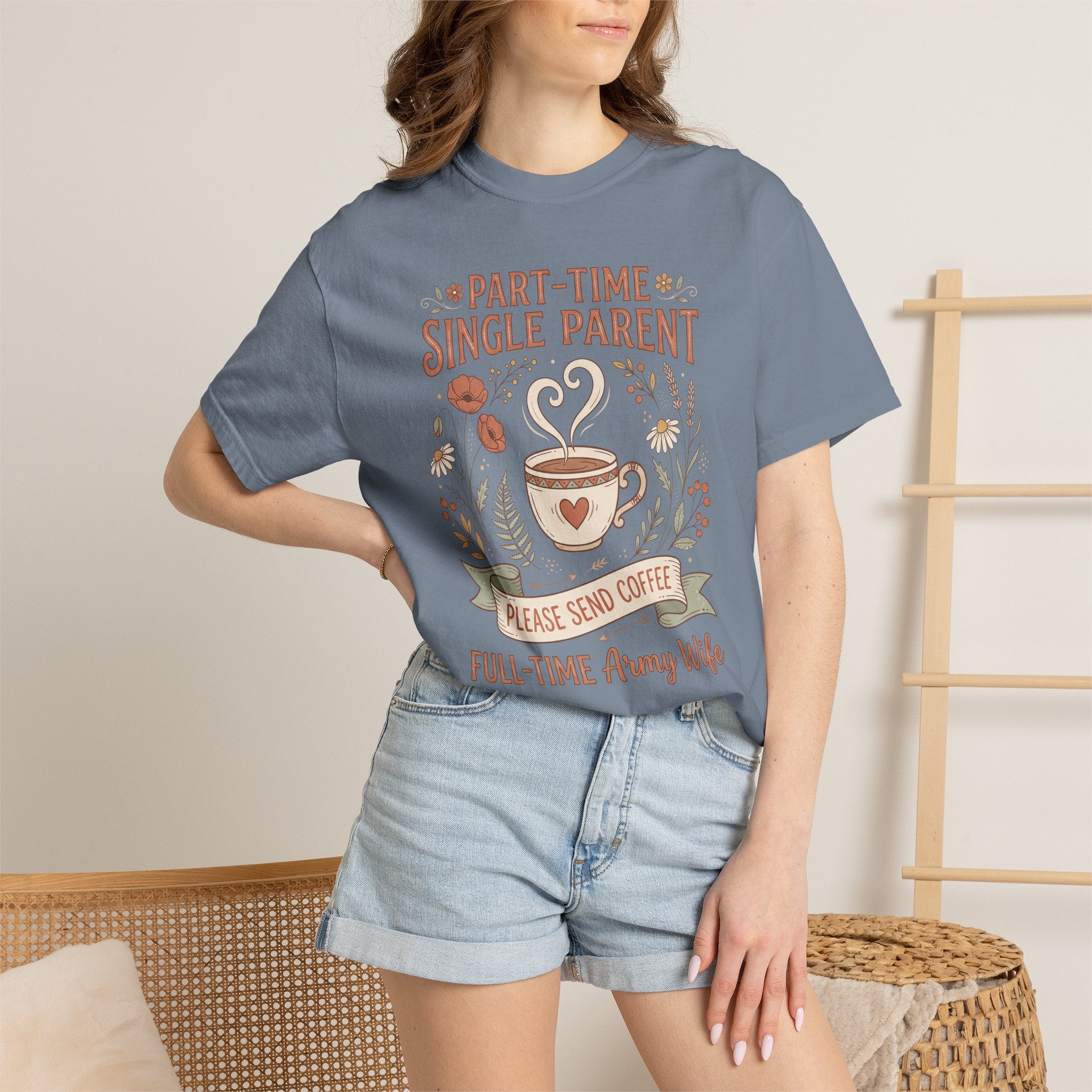 Blue-gray t-shirt worn by model with floral coffee graphic and heart icon