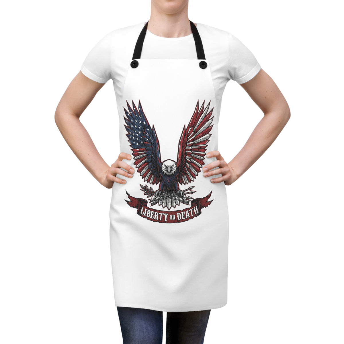 White kitchen apron on model with black straps and bold eagle design text