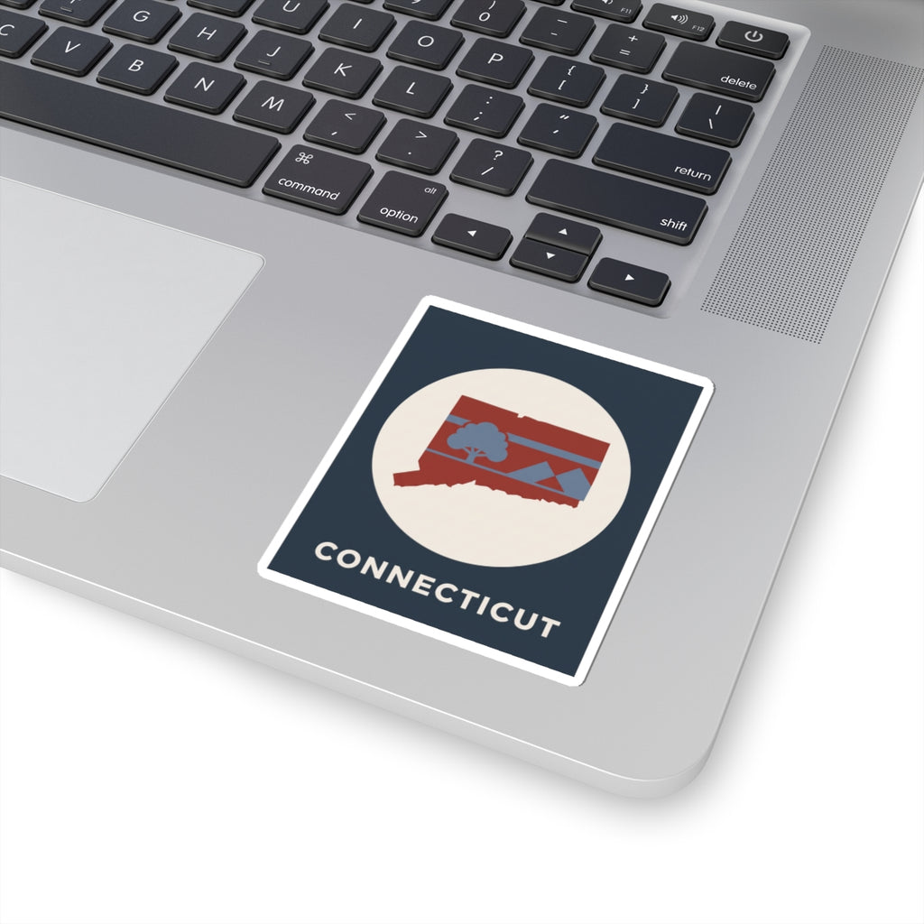 Connecticut state map sticker on laptop lid with retro circle and 'CONNECTICUT'
