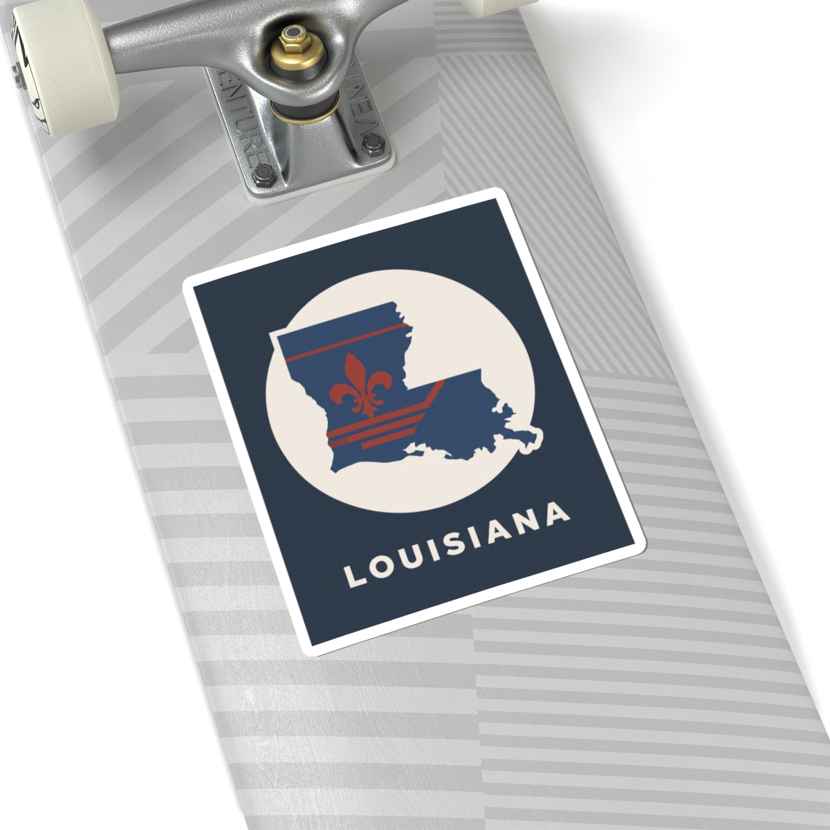 Louisiana sticker on luggage surface with state map, fleur-de-lis, and "LOUISIANA" text