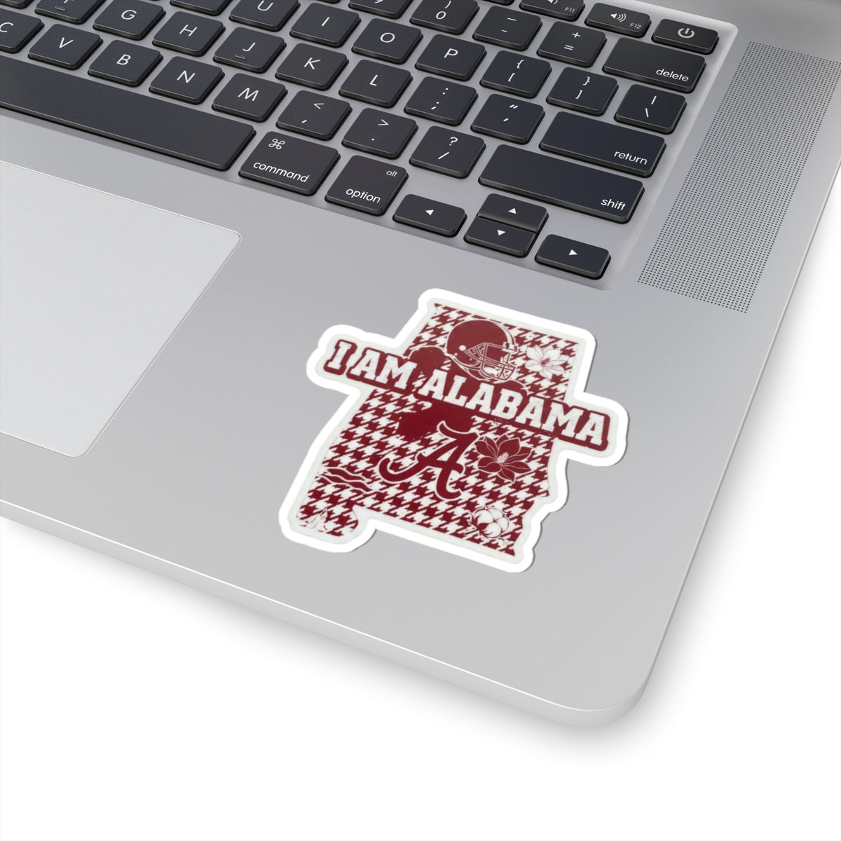 Alabama sticker in maroon and white, football helmet and “I AM ALABAMA” text