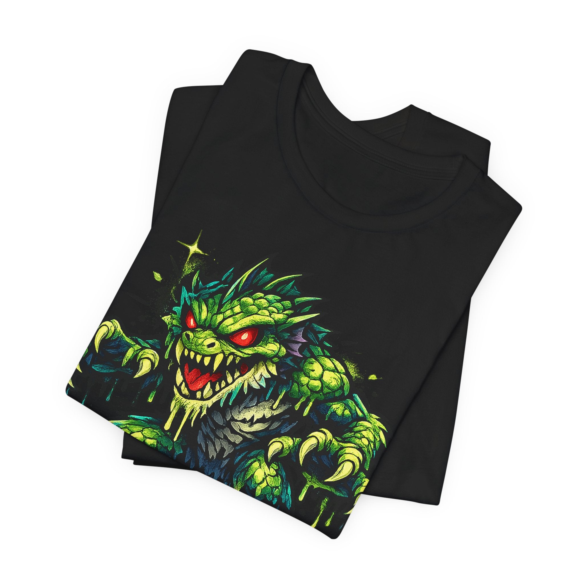 Black T-shirt with green swamp monster illustration on front graphic.