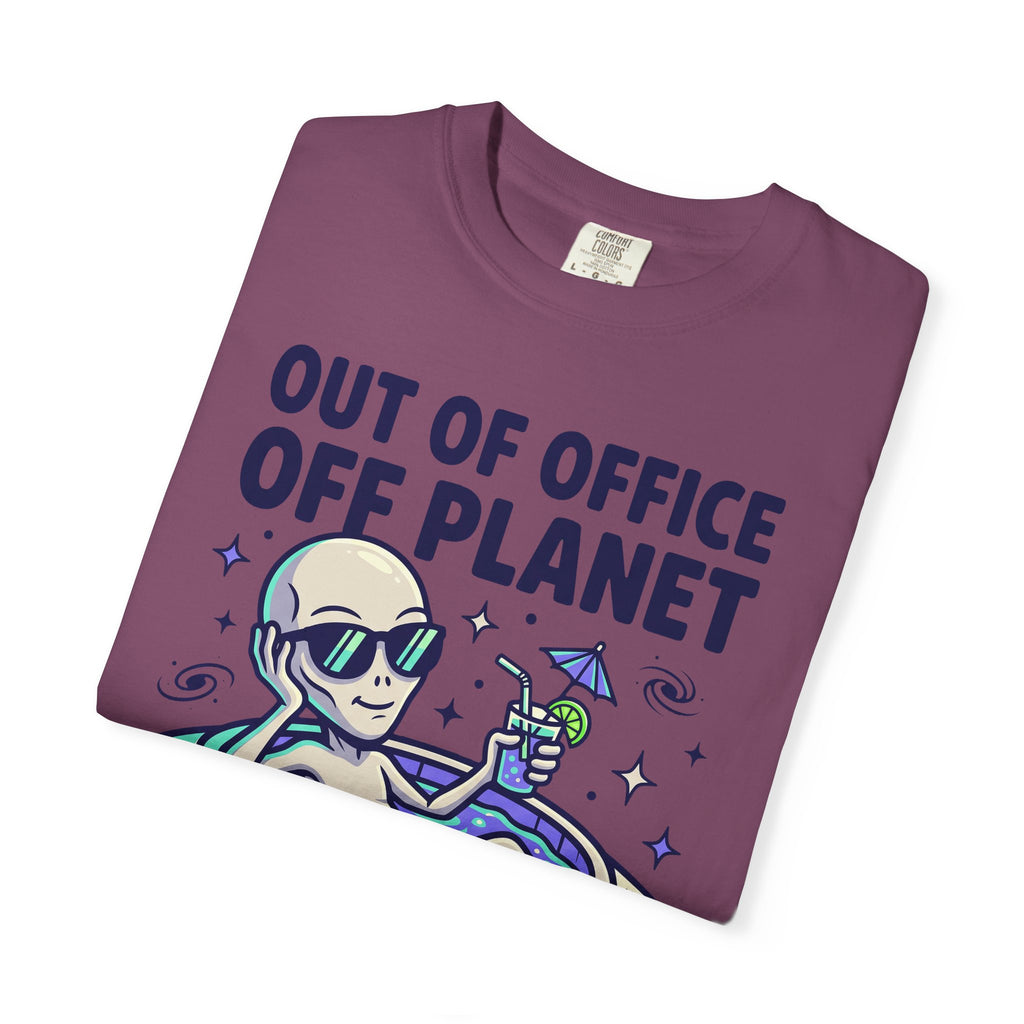 Purple crewneck T-shirt with alien floatie graphic and 'OUT OF OFFICE OFF PLANET' text