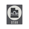 Utah metal wall art sign with dark square background, white circle, arch mountain graphic, UTah text