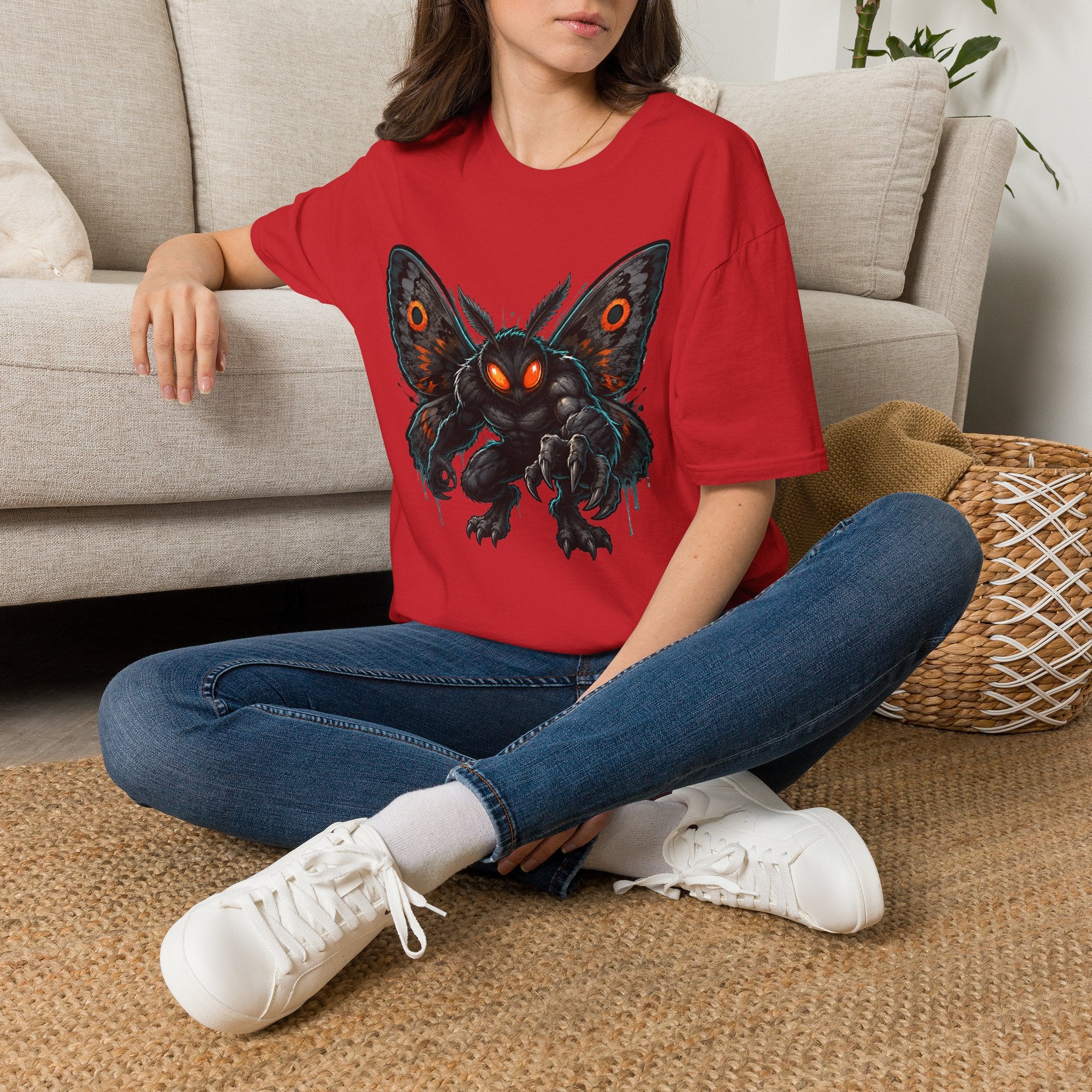 Red crew-neck T-shirt with detailed black moth monster graphic on chest.