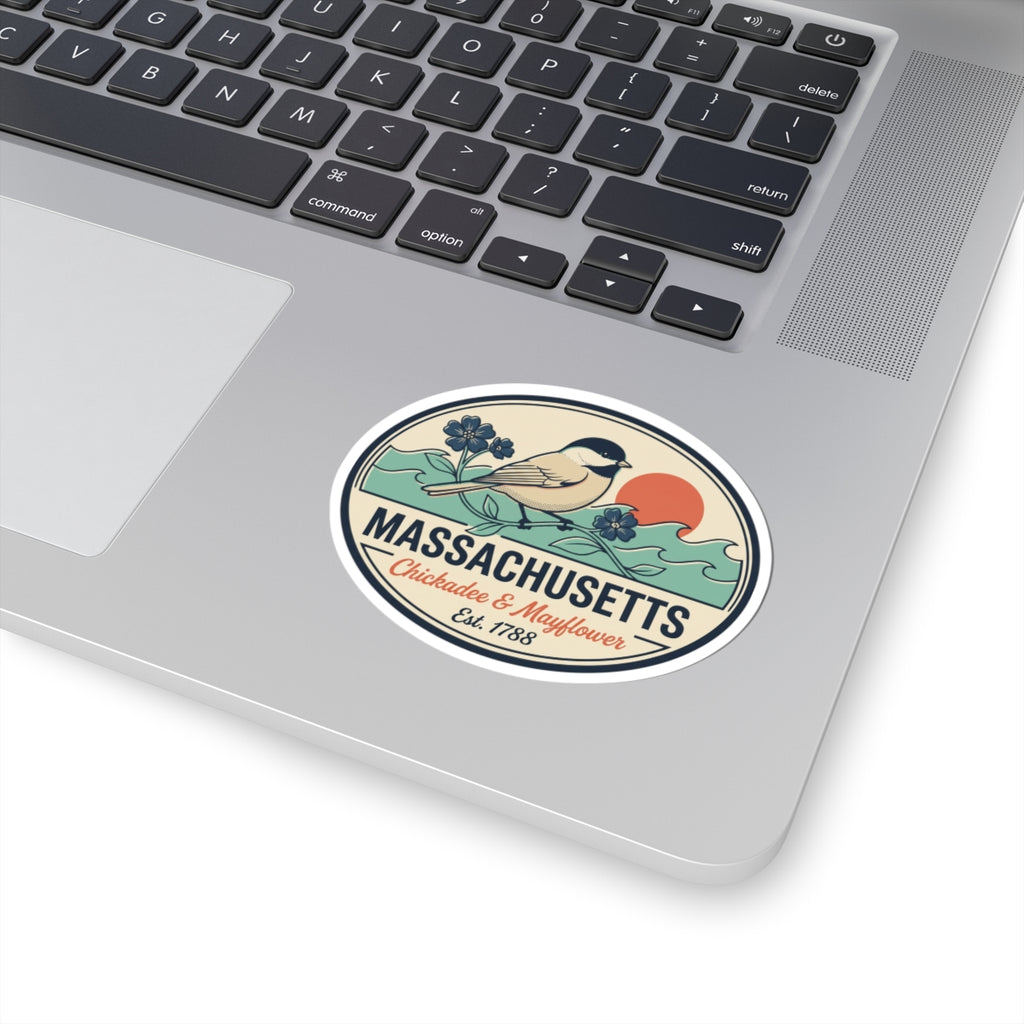 Round sticker on laptop keyboard showing Massachusetts badge with chickadee and 'Est. 1788'