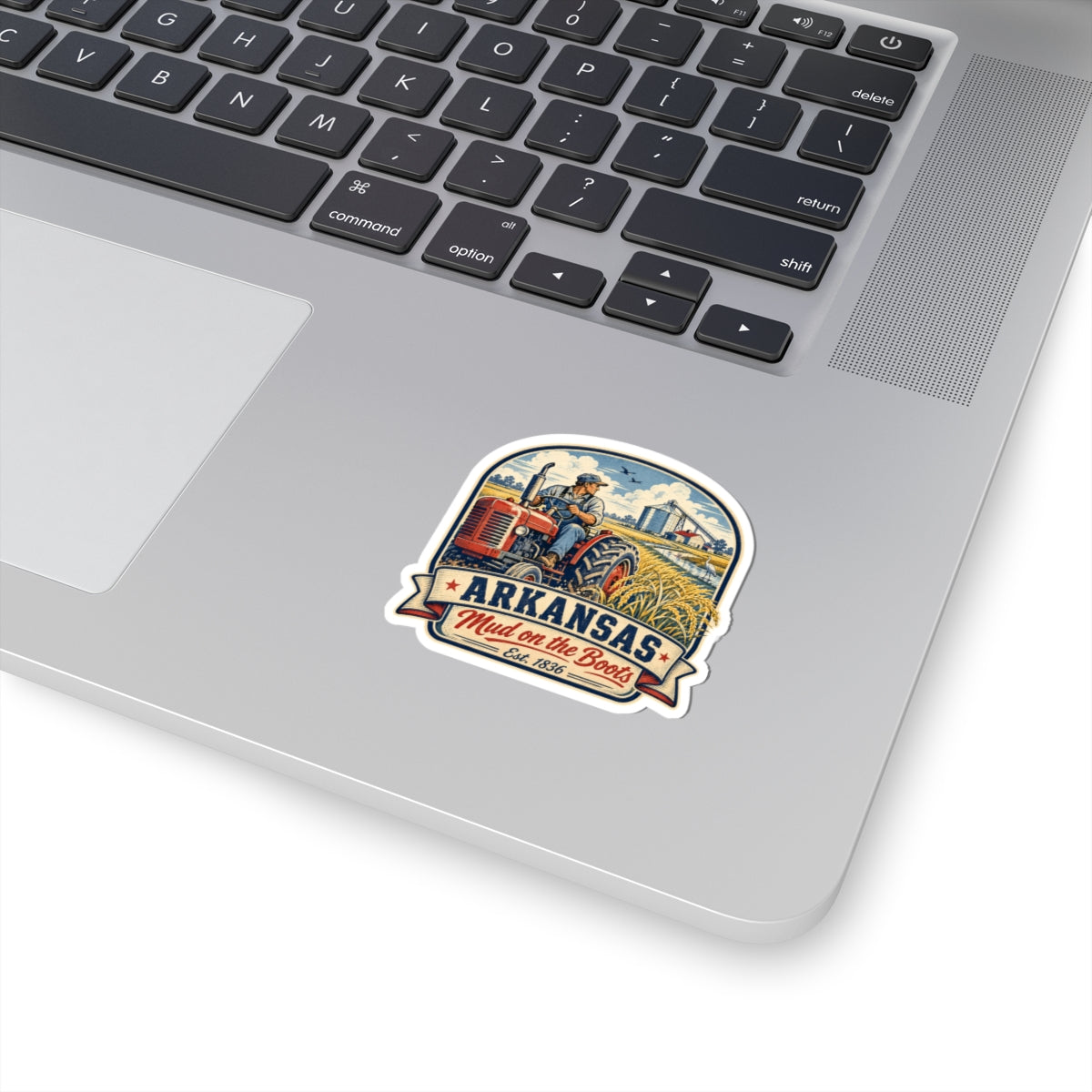 Rounded kiss-cut sticker with Arkansas text, tractor and boot artwork