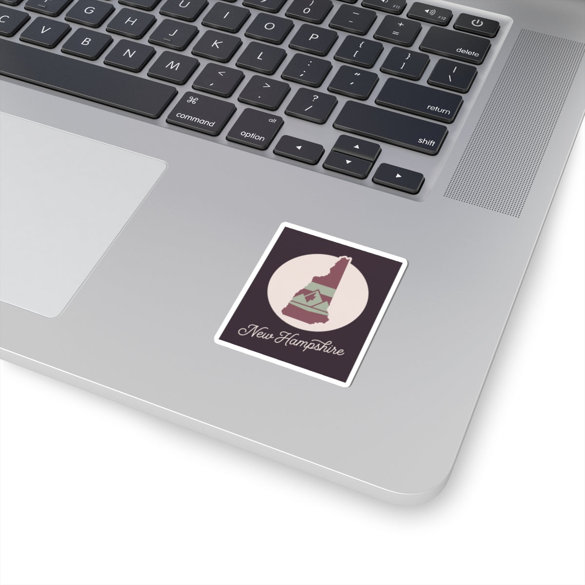 New Hampshire state silhouette kiss-cut decal sticker on a laptop lid