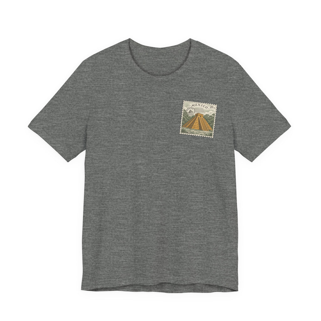 Dark heather gray t-shirt with small vintage-style Mexico stamp graphic at upper chest