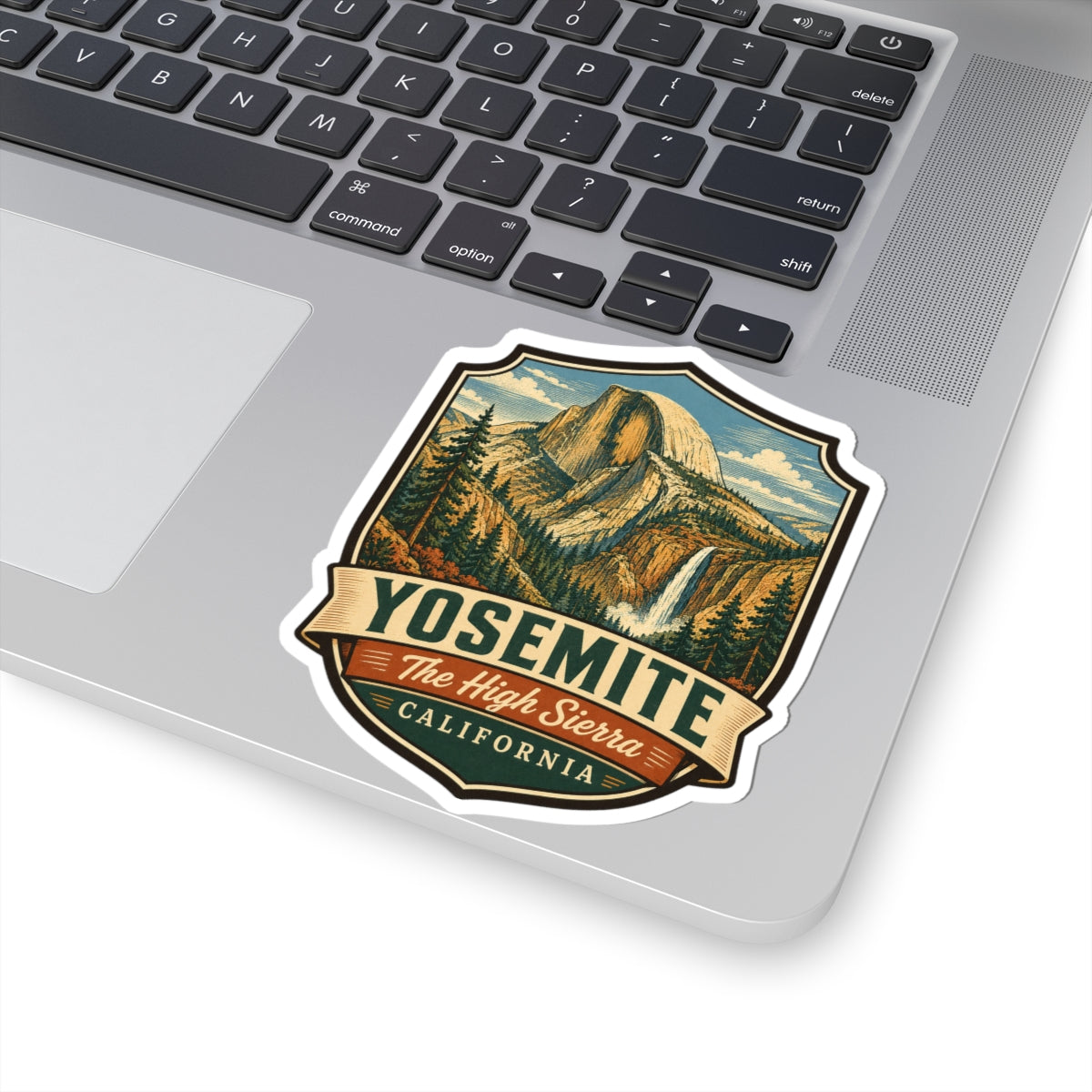 Yosemite sticker on laptop, Half Dome shield design with The High Sierra text