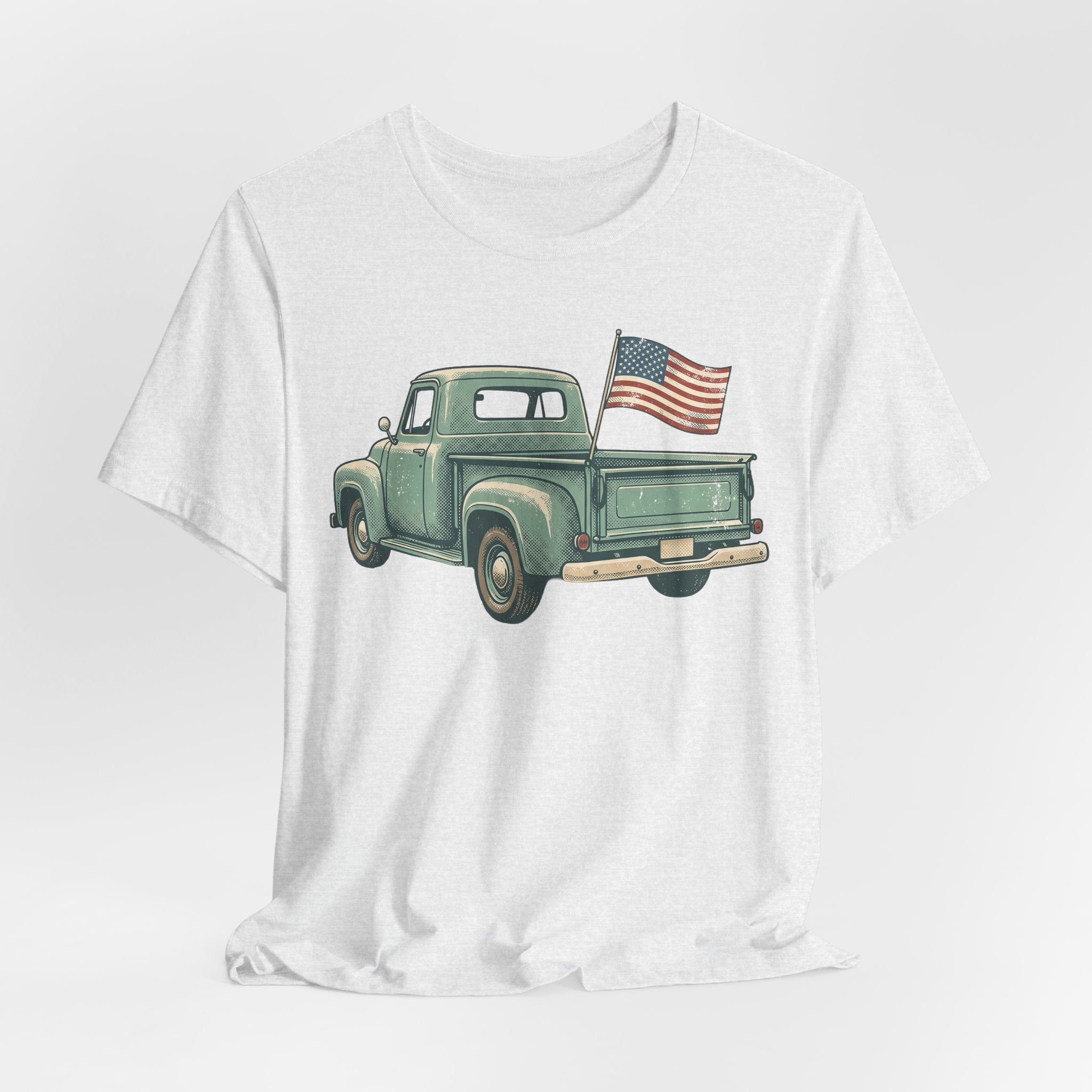 White T-shirt with green vintage pickup truck and small U.S. flag graphic on front