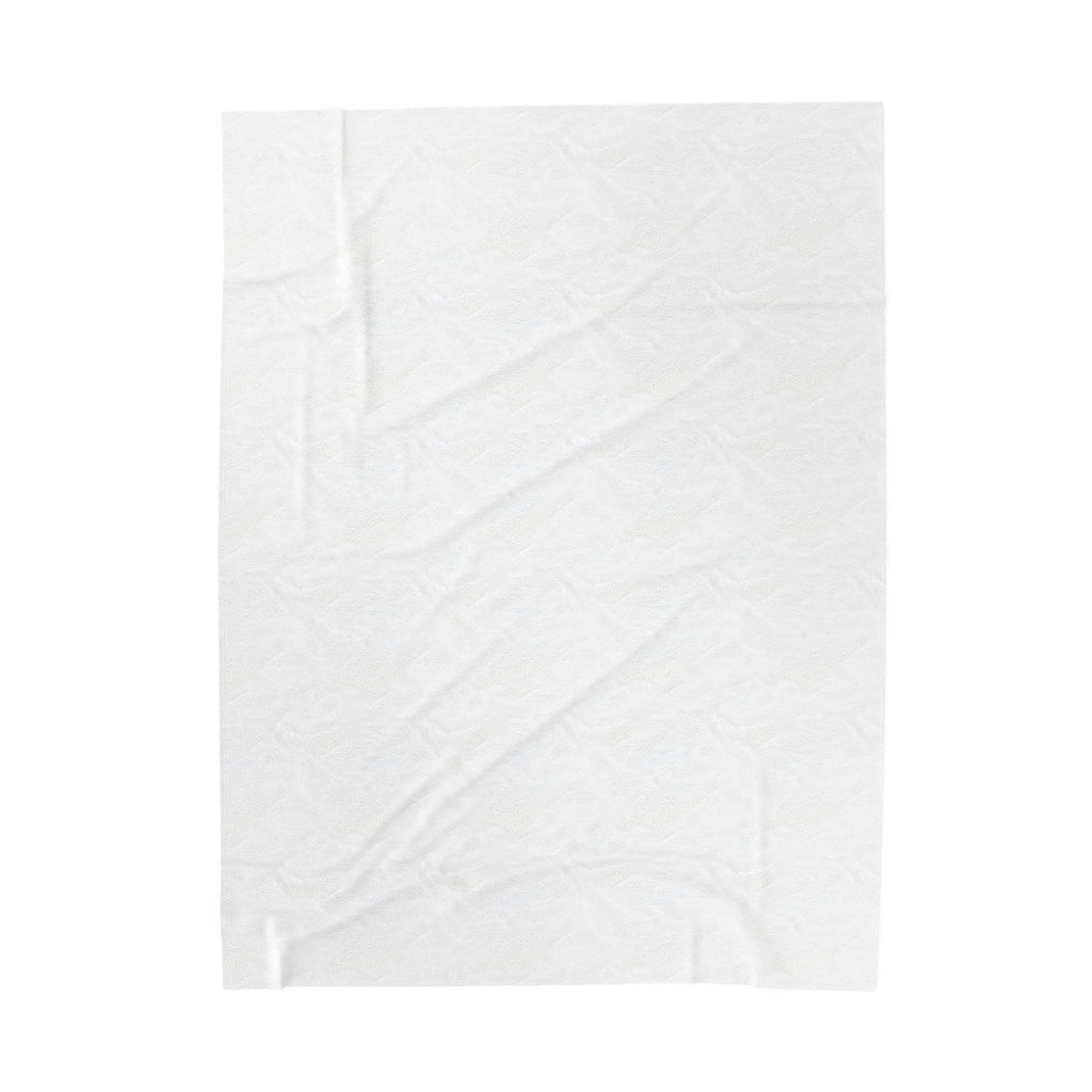 Velveteen plush blanket with subtle textured surface, light-colored
