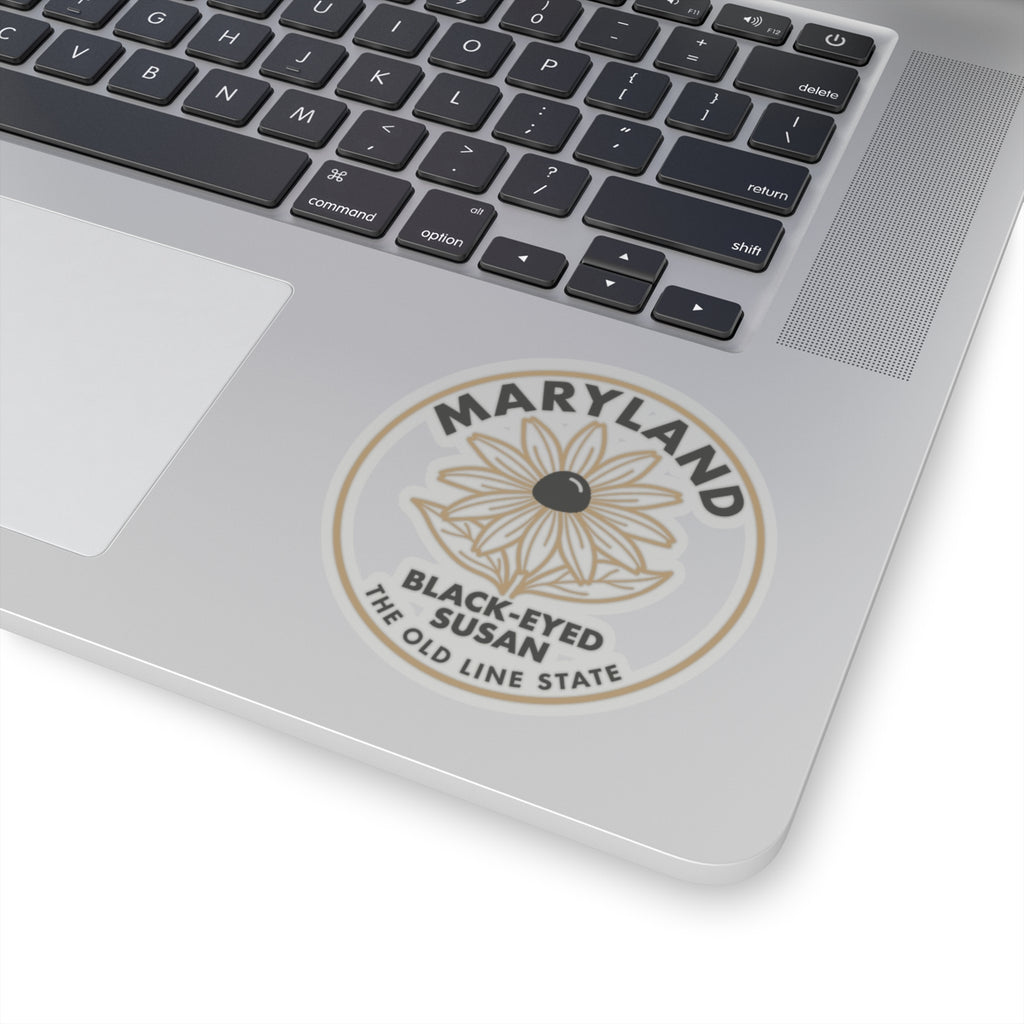 Circular Maryland black-eyed Susan sticker on laptop lid, full design with state text ring.