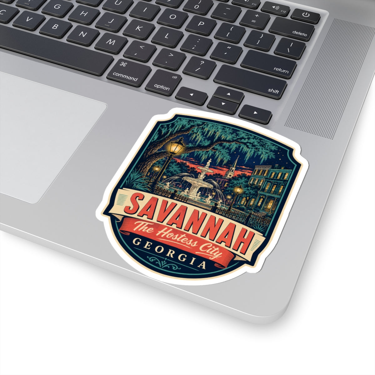 Savannah luggage tag sticker on laptop, city fountain illustration and SAVANNAH text