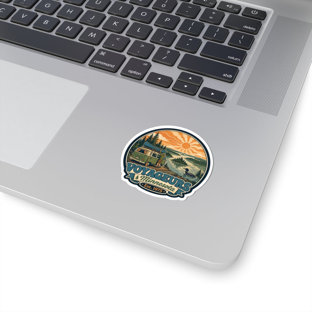 Vintage Voyageurs National Park camper van sticker, circular design with orange sun and forest