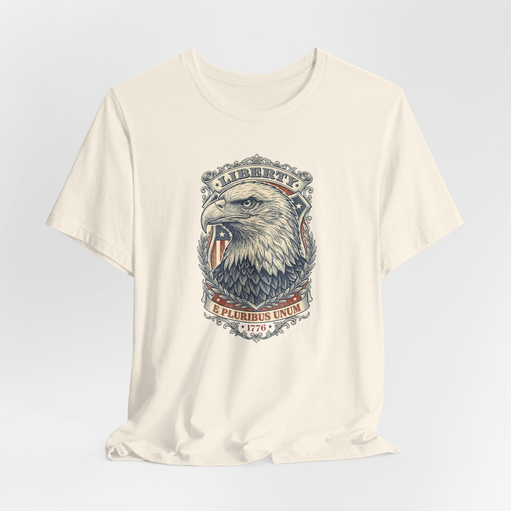 Cream crewneck tee with bald eagle head graphic and circular “E Pluribus Unum” design