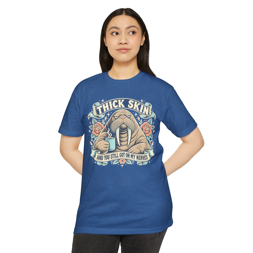 Light blue crew-neck graphic T-shirt with walrus illustration and “Thick Skin” text
