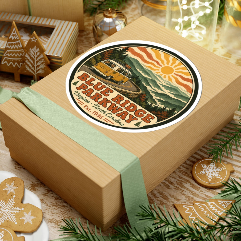 Round Blue Ridge Parkway sticker on gift box: yellow camper van, mountain scenery, sun and lettering