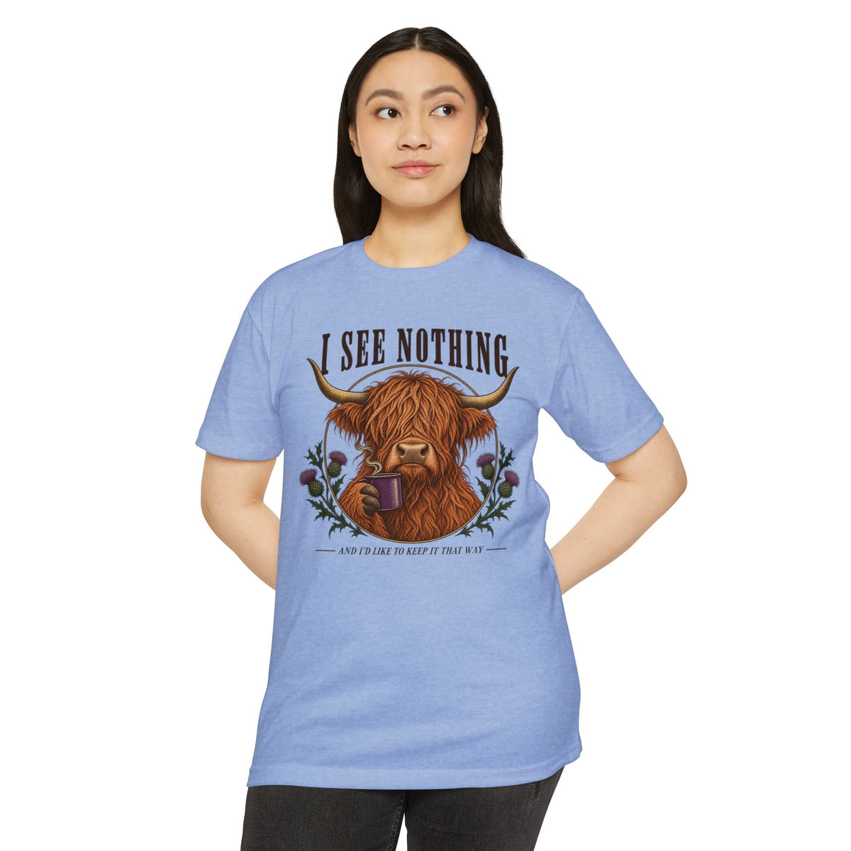 Light blue crewneck T-shirt with Highland cow “I See Nothing” graphic